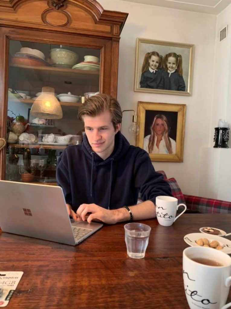 Picture of Max working on a laptop